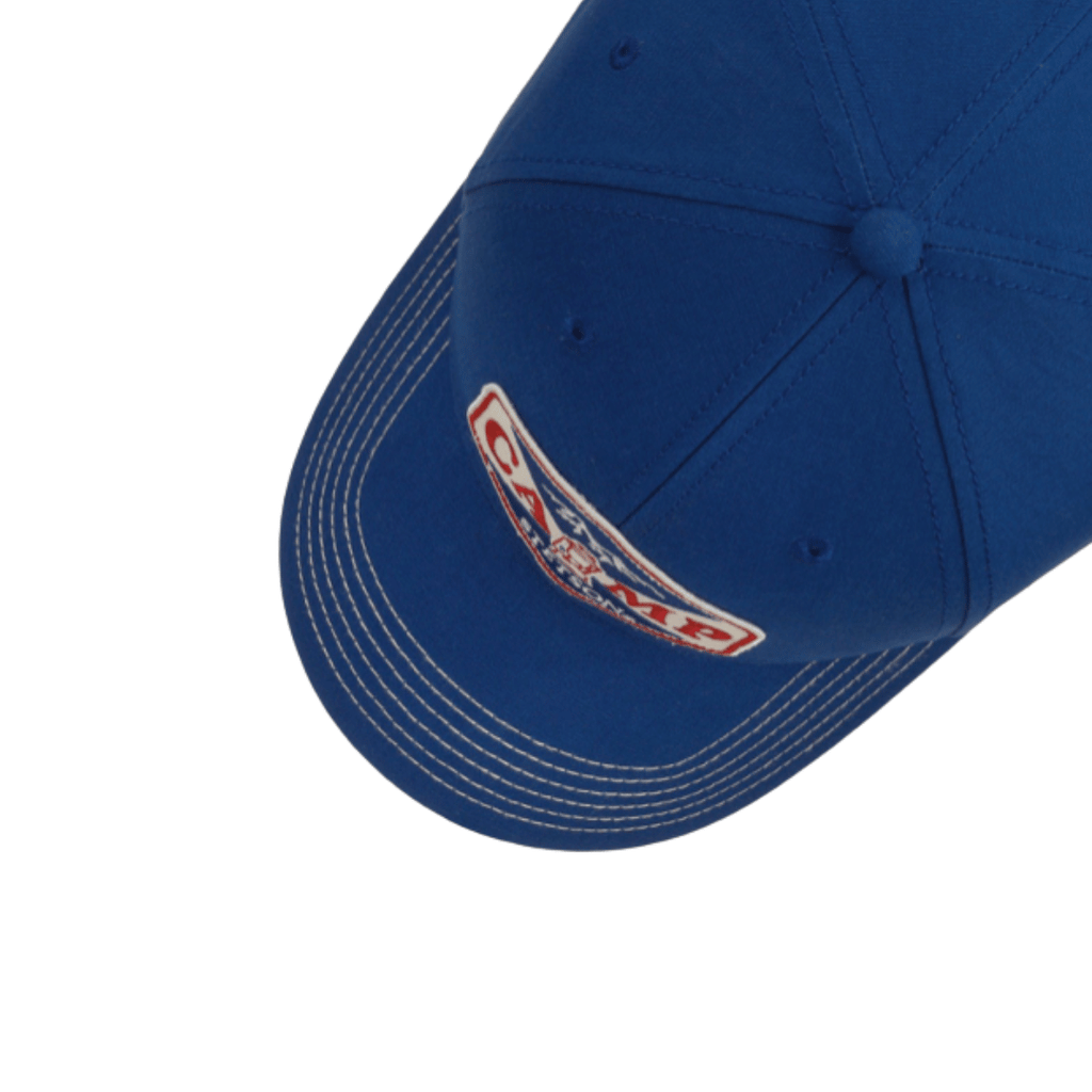 Blue cap with a logo on the side against a white background