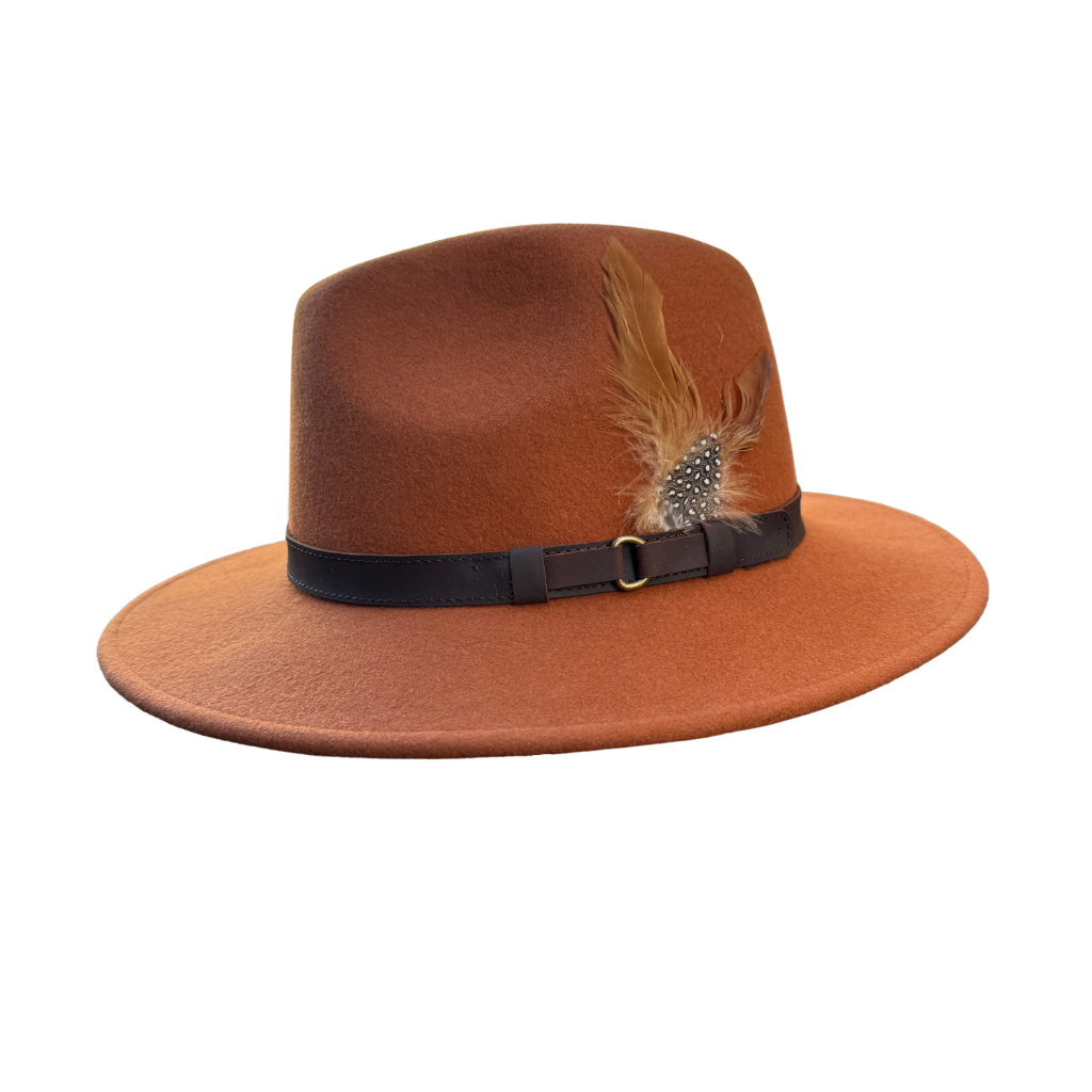 Rust fedora hat with a feather from Sussex Hats, Arundel